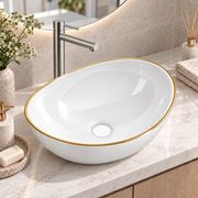 Noxwell AB-4134-G gloss white oval countertop basin with gold rim on a bathroom vanity